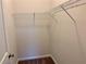 This walk-in closet has wire rack shelving with neutral colored walls and carpet at 407 Johnson Ct, Alpharetta, GA 30009