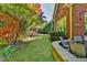 Well-maintained backyard with lush landscaping, featuring a stone patio and a private, fenced yard at 7940 Royal Melbourne Way, Duluth, GA 30097