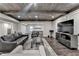 Finished basement featuring wood ceilings, laminate floors, comfortable furniture, and open floor plan at 7940 Royal Melbourne Way, Duluth, GA 30097