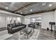 Finished basement featuring wood ceilings, laminate floors, comfortable furniture, and open floor plan at 7940 Royal Melbourne Way, Duluth, GA 30097