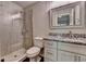 Bathroom featuring granite counters, modern fixtures, and a glass walk-in shower at 7940 Royal Melbourne Way, Duluth, GA 30097