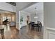 Formal dining room with hardwood floors, stylish chandelier, and access to living spaces at 7940 Royal Melbourne Way, Duluth, GA 30097