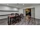 Basement dining room with laminate floors and wooden dining table at 7940 Royal Melbourne Way, Duluth, GA 30097