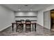Basement dining room with laminate floors and wooden dining table at 7940 Royal Melbourne Way, Duluth, GA 30097