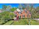 Charming two-story brick home with lush landscaping and mature trees in a tranquil setting at 7940 Royal Melbourne Way, Duluth, GA 30097