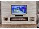 The fireplace with modern design elements provides an eye-catching focal point to the room at 7940 Royal Melbourne Way, Duluth, GA 30097