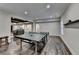Nicely finished entertainment room featuring ping pong table, hardwood floors, and neutral decor at 7940 Royal Melbourne Way, Duluth, GA 30097