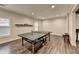 Spacious game room with hardwood floors, recessed lighting, and a Butterfly brand ping pong table at 7940 Royal Melbourne Way, Duluth, GA 30097