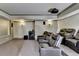 Cozy home theater with tiered seating, projector, and wall sconces at 7940 Royal Melbourne Way, Duluth, GA 30097