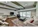 Comfortable living room with coffered ceilings, large windows, and modern furnishings at 7940 Royal Melbourne Way, Duluth, GA 30097