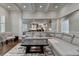 Spacious living area with a cozy sectional sofa, providing ample seating and comfort at 7940 Royal Melbourne Way, Duluth, GA 30097