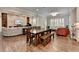 Open concept living area seamlessly blends with the dining area, and natural lighting at 7940 Royal Melbourne Way, Duluth, GA 30097
