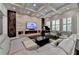 Elegant living room features a coffered ceiling, fireplace and a built-in entertainment center at 7940 Royal Melbourne Way, Duluth, GA 30097
