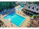 Overhead view of the neighborhood pool and clubhouse with nearby parking, tennis courts, and playground at 7940 Royal Melbourne Way, Duluth, GA 30097