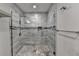 Well lit shower space featuring glass walls and upscale tile work at 7940 Royal Melbourne Way, Duluth, GA 30097