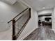 An interior shot of the house staircase that features a wood handrail at 7940 Royal Melbourne Way, Duluth, GA 30097