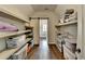 Spacious walk-in closet with custom shelving, providing ample storage solutions for an organized home at 7940 Royal Melbourne Way, Duluth, GA 30097