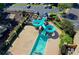 Aerial view of the fun community pool waterslide and surrounding playground area at 7940 Royal Melbourne Way, Duluth, GA 30097
