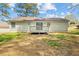 Expansive backyard featuring a deck and mature trees at 10331 Wrens Dr, Jonesboro, GA 30238
