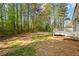Expansive backyard featuring a deck, ideal for outdoor enjoyment and relaxation amongst mature trees at 10331 Wrens Dr, Jonesboro, GA 30238