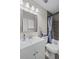 Nicely appointed bathroom with tiled shower over bath and white vanity at 10331 Wrens Dr, Jonesboro, GA 30238