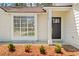 Close-up of front entrance with new mulch and a tidy exterior at 10331 Wrens Dr, Jonesboro, GA 30238