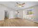 Bright, airy living area with a large window and ceiling fan at 10331 Wrens Dr, Jonesboro, GA 30238