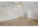 Spacious living area featuring new flooring and a ceiling fan at 10331 Wrens Dr, Jonesboro, GA 30238