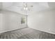 A spacious main bedroom is bathed in natural light from the window and features neutral carpet at 10331 Wrens Dr, Jonesboro, GA 30238