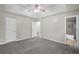 The spacious main bedroom offers neutral carpet and an attached bathroom with shower and bath at 10331 Wrens Dr, Jonesboro, GA 30238