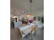 Dining room features modern lighting, a stylish wooden table, and decor at 315 Hillcrest View Dr, Suwanee, GA 30024