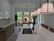 Bright kitchen featuring a spacious island, pendant lighting, and modern cabinetry at 315 Hillcrest View Dr, Suwanee, GA 30024