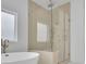 Bathroom featuring a soaking tub and walk-in shower with glass enclosure at 315 Hillcrest View Drive, Suwanee, GA 30024