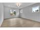Spacious bedroom featuring natural light, gray walls, and hardwood floors at 315 Hillcrest View Drive, Suwanee, GA 30024
