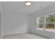 Bright bedroom featuring a large window and neutral decor at 315 Hillcrest View Drive, Suwanee, GA 30024