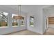 Bright dining area with large windows and modern lighting at 315 Hillcrest View Drive, Suwanee, GA 30024