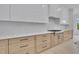 Bright, modern kitchen features sleek cabinetry, stainless steel appliances, and stylish countertops at 315 Hillcrest View Drive, Suwanee, GA 30024