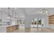 Bright interior showcasing open-concept design with modern kitchen, dining and access to the outdoor space at 315 Hillcrest View Drive, Suwanee, GA 30024