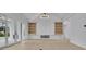 Beautiful living space featuring built-in shelving and access to the outdoor living area at 315 Hillcrest View Drive, Suwanee, GA 30024
