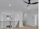 Loft area featuring hardwood floors, recessed lighting, and stairs with metal balusters at 315 Hillcrest View Drive, Suwanee, GA 30024