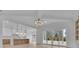 Open-concept living area with modern kitchen, dining space, and access to the outdoor patio at 315 Hillcrest View Drive, Suwanee, GA 30024