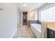 Bathroom featuring a large soaking tub next to a vanity and a tiled walk-in shower at 4915 Wycliffe Dr, Stone Mountain, GA 30087