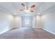 Large bedroom with plush carpeting, neutral paint, and recessed lighting, creating a cozy and inviting retreat at 4915 Wycliffe Dr, Stone Mountain, GA 30087