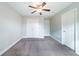 Spacious bedroom featuring a ceiling fan and plenty of closet space at 4915 Wycliffe Dr, Stone Mountain, GA 30087