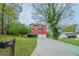 Charming two-story home with a two-car garage and a well-maintained front yard and driveway at 4915 Wycliffe Dr, Stone Mountain, GA 30087