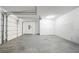 This two-car garage features dual doors, painted floors, and ample storage space at 4915 Wycliffe Dr, Stone Mountain, GA 30087