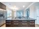 Well-appointed kitchen featuring stainless steel appliances, a granite island with a gas cooktop, and hardwood floors at 4915 Wycliffe Dr, Stone Mountain, GA 30087