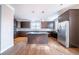 Stylish kitchen with a center island, stainless steel appliances, dark wood cabinets, and granite countertops at 4915 Wycliffe Dr, Stone Mountain, GA 30087
