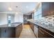 Contemporary kitchen with a gas cooktop, stainless steel appliances, granite countertops, and modern cabinetry at 4915 Wycliffe Dr, Stone Mountain, GA 30087