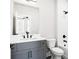 Modern bathroom featuring a gray vanity, sleek fixtures, and tub with shower at 7210 Summit Pl, Alpharetta, GA 30009